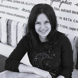 A photograph of Michelle Gauthier in her restaurant, Mulberry & Vine